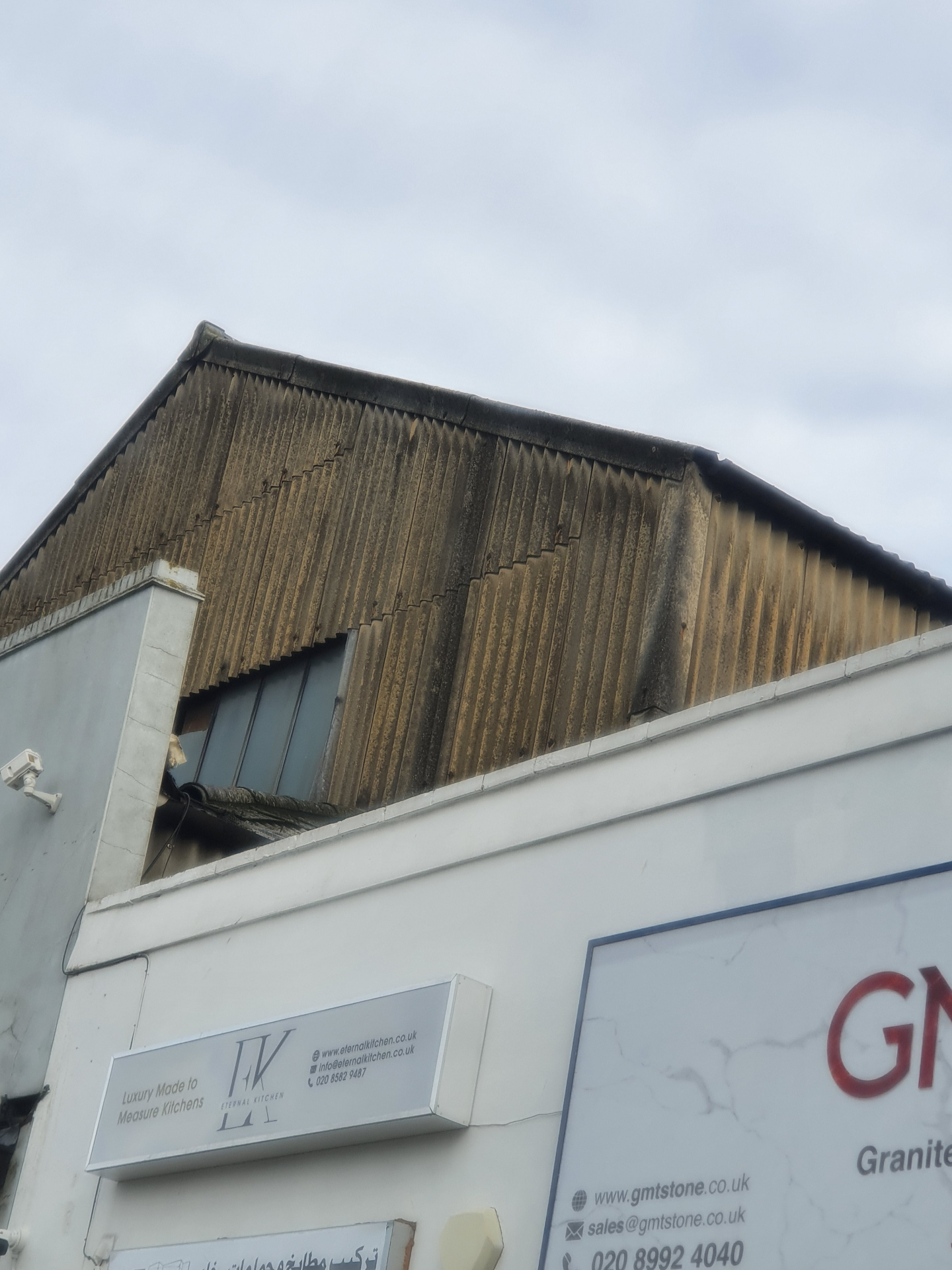 Corrugated garage roofs photographed during an Elements asbestos survey